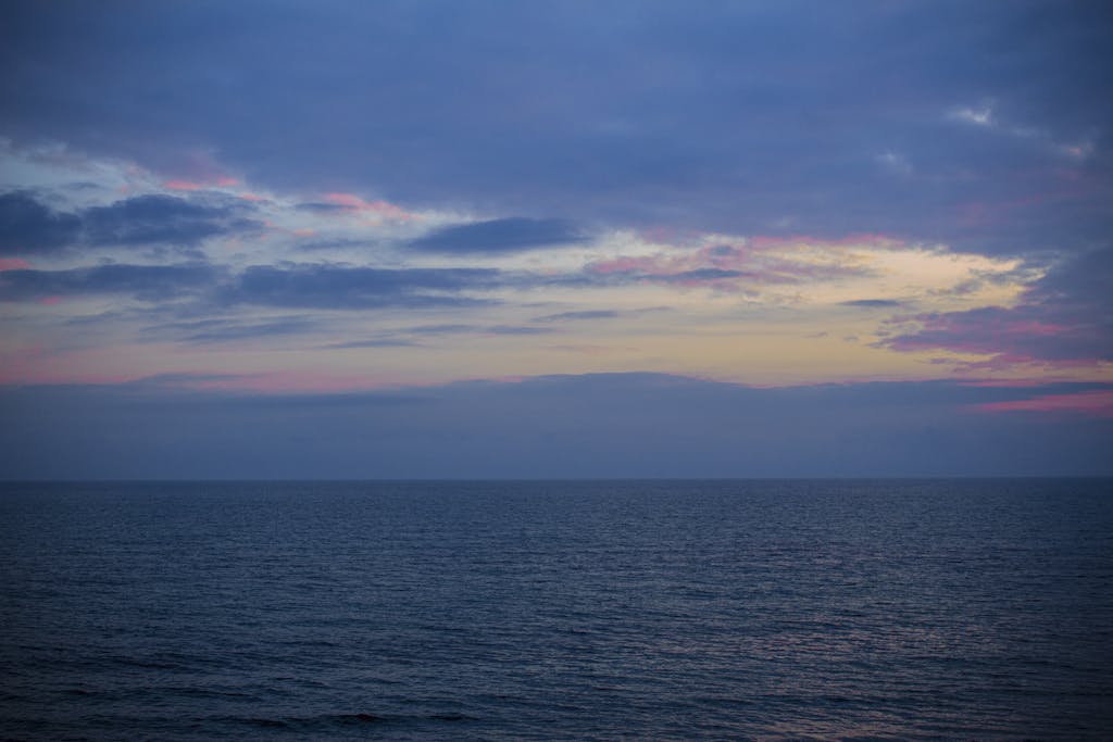 Peaceful sunset view over the Adriatic Sea from Grado, Italy.