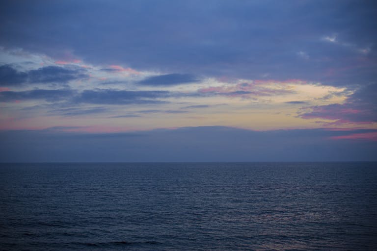 Peaceful sunset view over the Adriatic Sea from Grado, Italy.